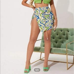 colorful asymmetrical skirt with chain belt